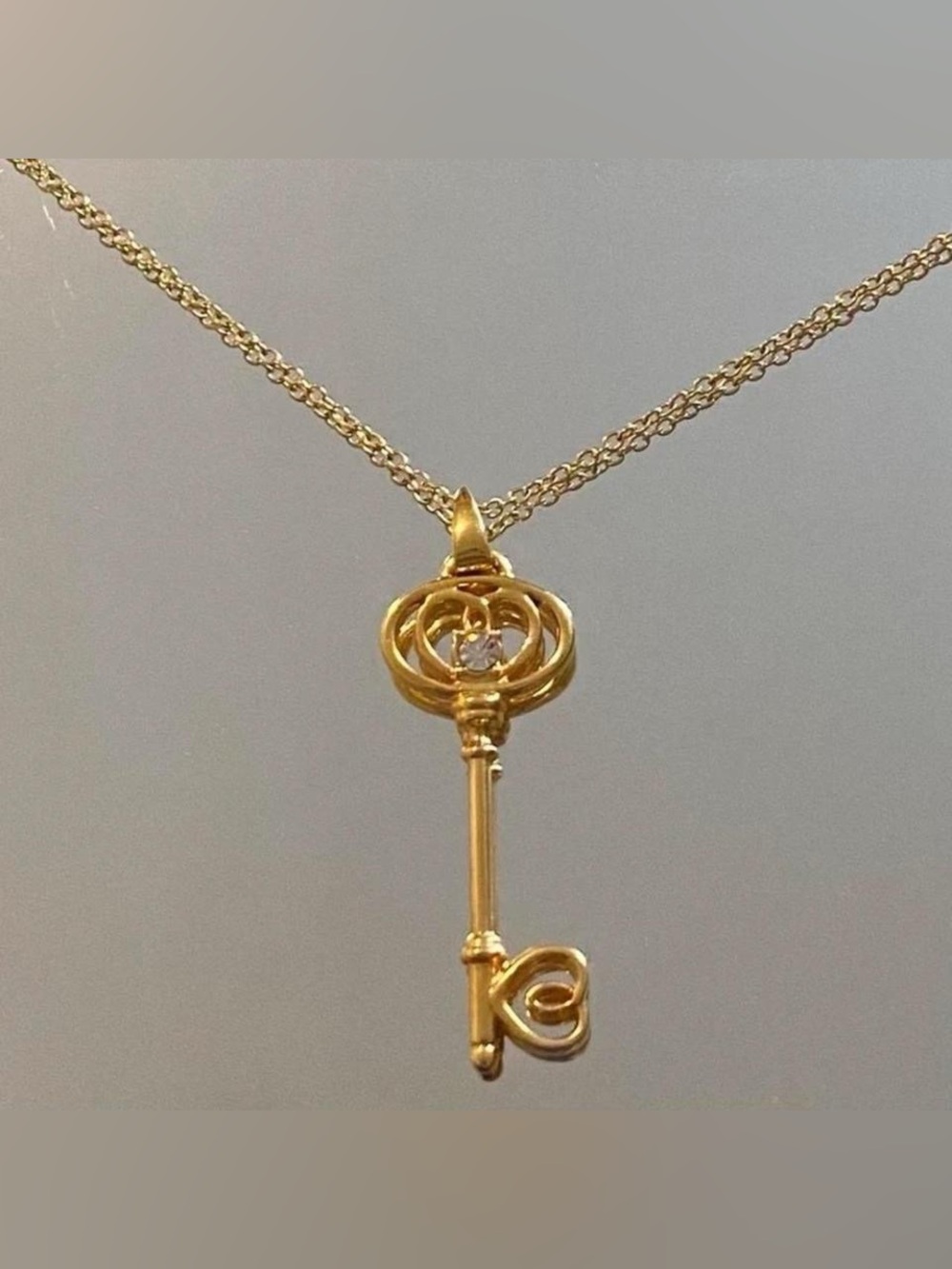 Gold key pendant necklace